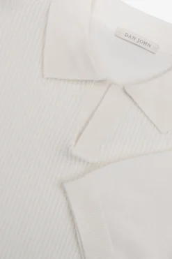 Polo in maglia collo aperto armaturata panna