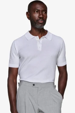 Polo in maglia punto dadino bianca