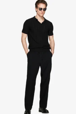 Polo in maglia traforata nera