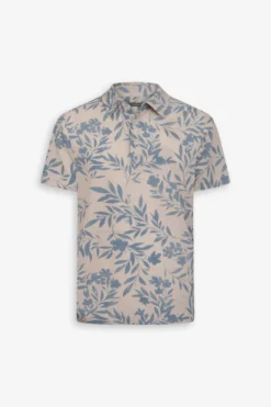 Polo in piquet fantasia fiore celeste